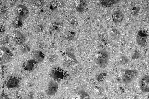 Sponge detail texture, sponge texture closeup background. Cellulose sponge texture. Black and white © OlegD