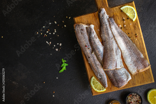 fish raw hake (set of ingredients for cooking). food background. top view. copy space
