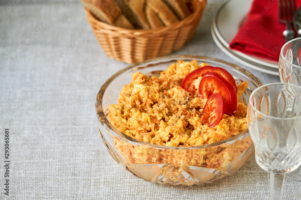 Rice salad with carrots and cheese in a glass bowl Rice salad with carrots and cheese in a glass bowl