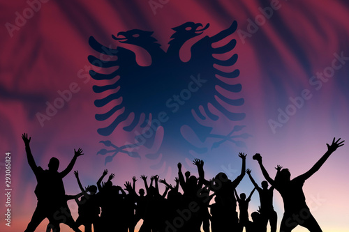 People and flag on day of Albania