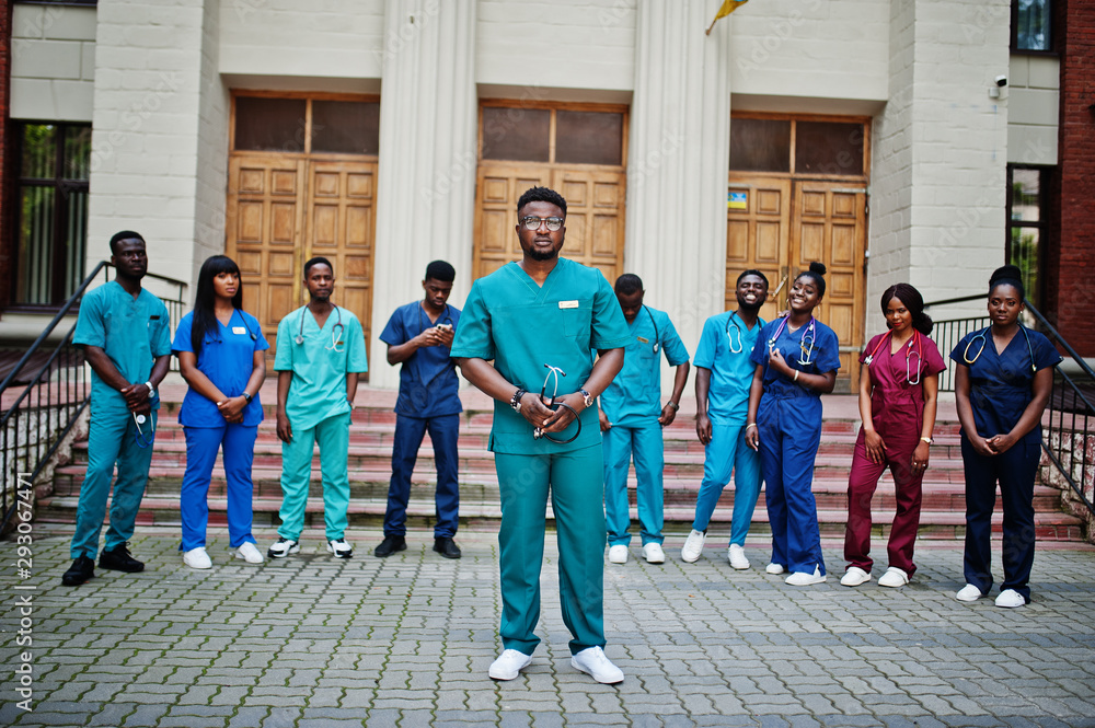 Naklejka premium Group of african medical students posed outdoor against university door.
