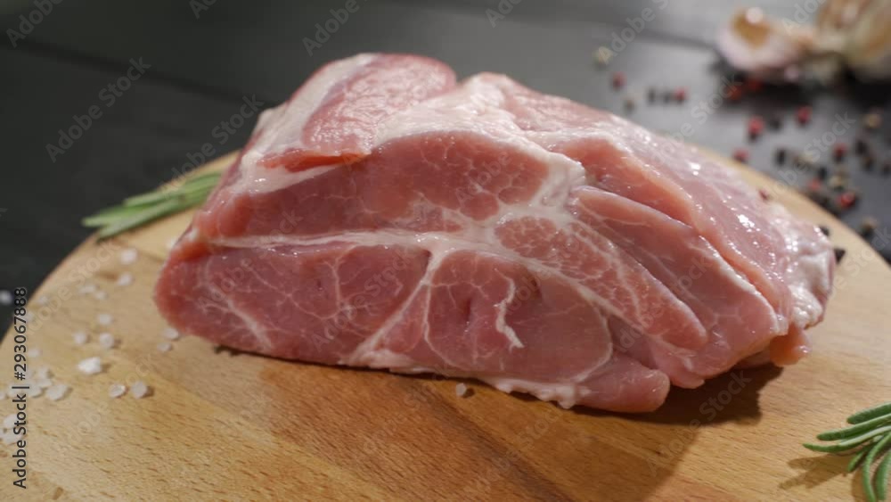 Raw beef steak on a dark wooden table Raw beef steak on a dark wooden table