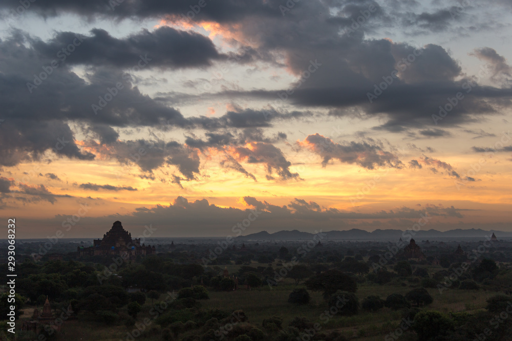 Dawn over the ancient Pagan city, Myanmar. The view from the top of Shwesandaw Temple.  View of Dhammayangyi Temple.