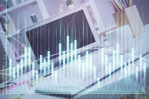 Stock market graph on background with desk and personal computer. Multi exposure. Concept of financial analysis. © peshkova