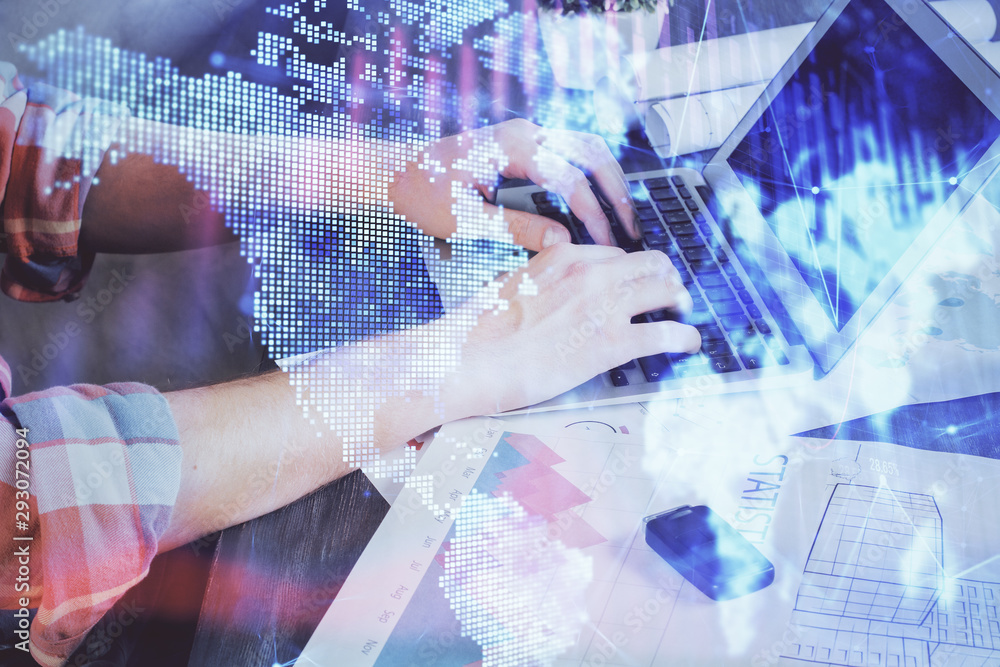 Double exposure of stock graph with businessman typing on computer in office on background. Concept of hard work. Double exposure of stock graph with businessman typing on computer in office on background. Concept of hard work.