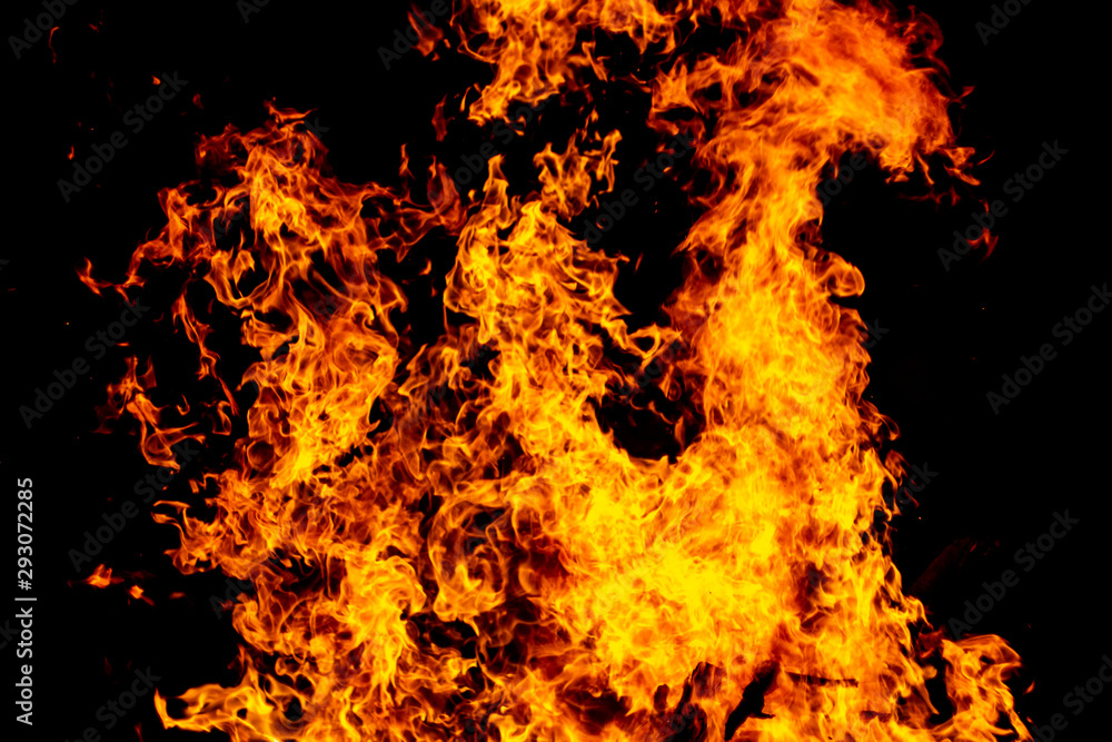 Big fire and silhouette of brazier on black background. Flame of fire in dark. Bonfire in barbecue at night. Dance of flame. Form of blaze Big fire and silhouette of brazier on black background. Flame of fire in dark. Bonfire in barbecue at night. Dance of flame. Form of blaze