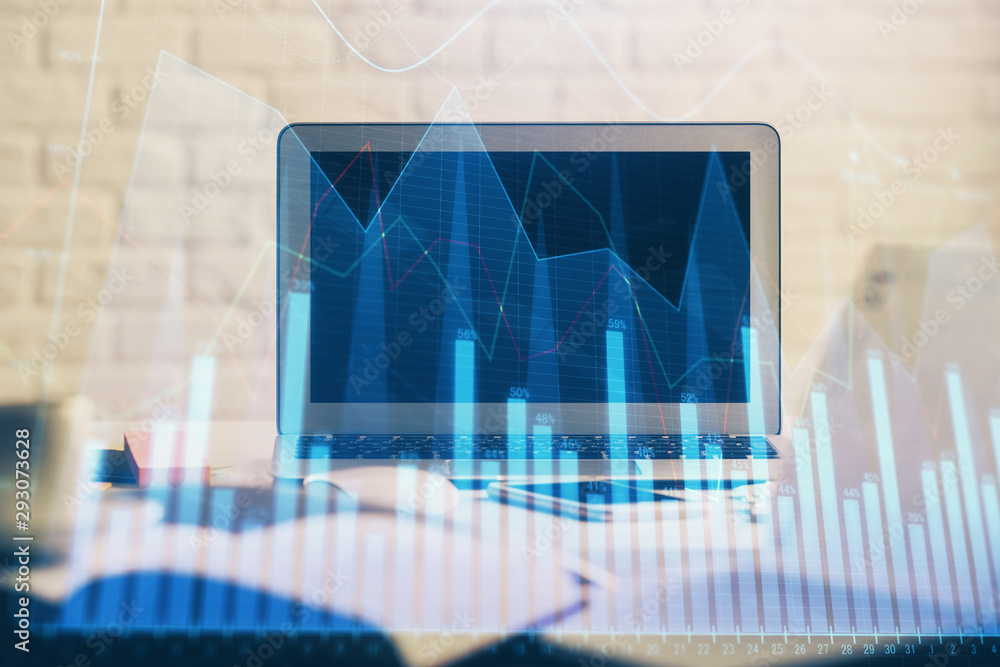 Stock market chart hologram drawn on personal computer background. Double exposure. Concept of investment. Stock market chart hologram drawn on personal computer background. Double exposure. Concept of investment.
