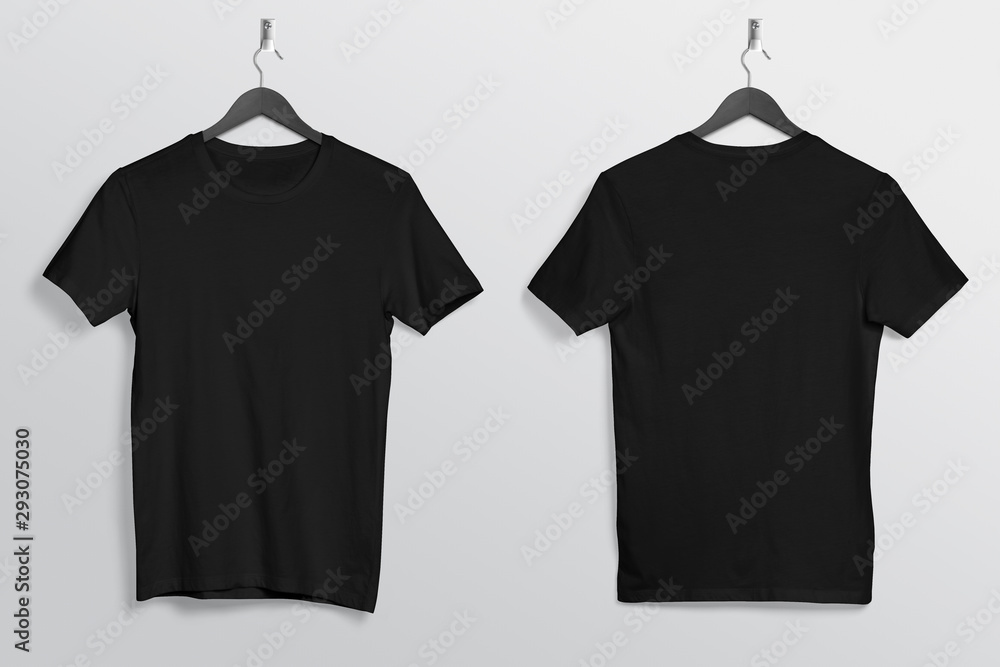 Front back of black plain crew neck t shirt hanging on wall Stock Photo