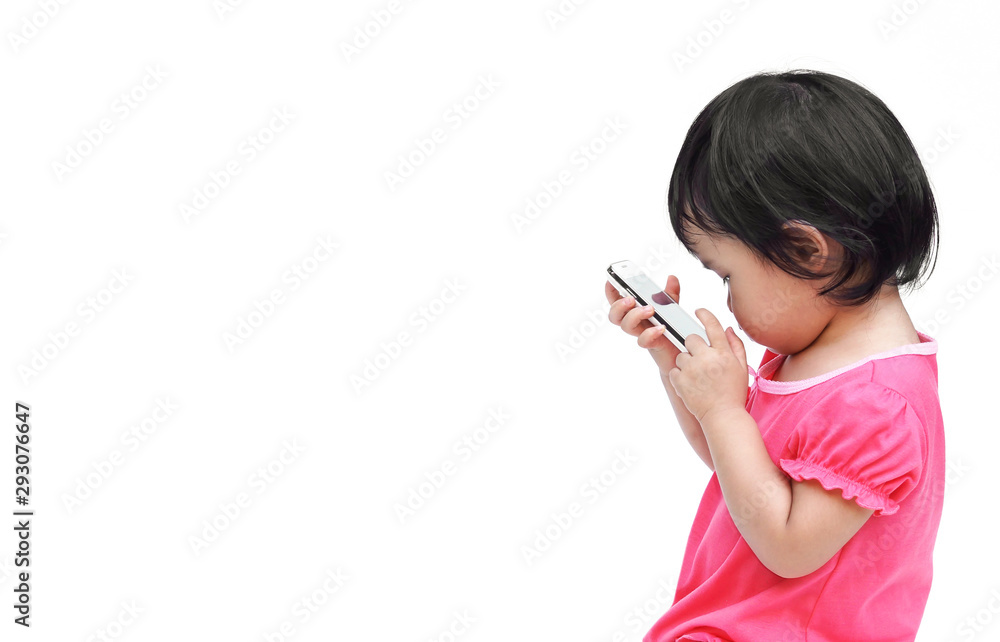 Asian kid playing with a smartphone isolated Asian kid playing with a smartphone isolated