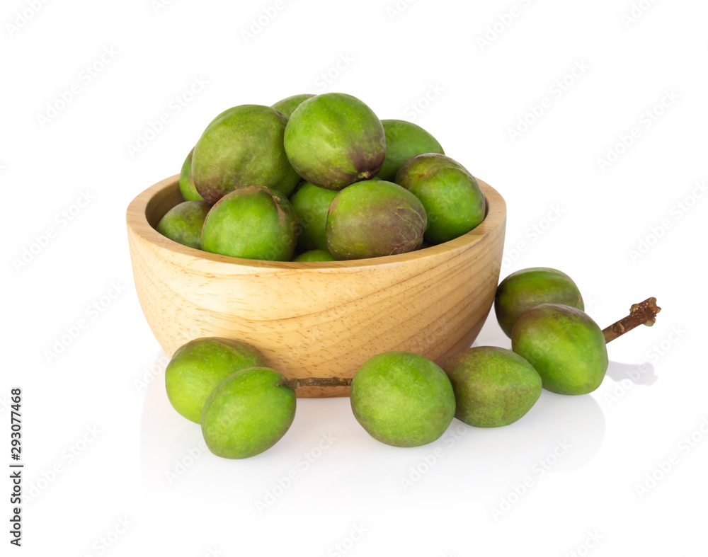 Chebulic Myrobalans in wood bowl isolated on white background, herb and medical Chebulic Myrobalans in wood bowl isolated on white background, herb and medical