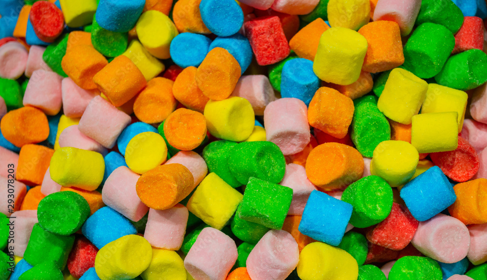 A huge pile of colorful marshmallows red, yellow, orange, green and blue. Colourful candy background A huge pile of colorful marshmallows red, yellow, orange, green and blue. Colourful candy background