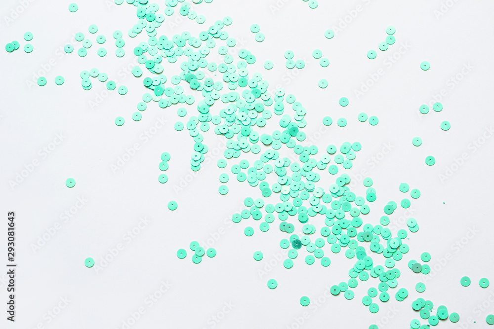 Pastel mint confetti stars on a white background. Holiday Party Concept
