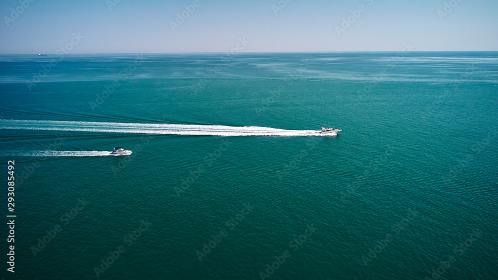 Aerial view of speed boat in sea, Ancona, Italy. Speed boat at sea, view from above