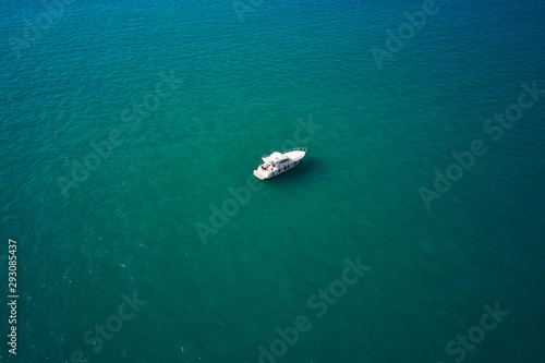 Aerial view of speed boat in sea, Ancona, Italy. Speed boat at sea, view from above © VAKSMANV