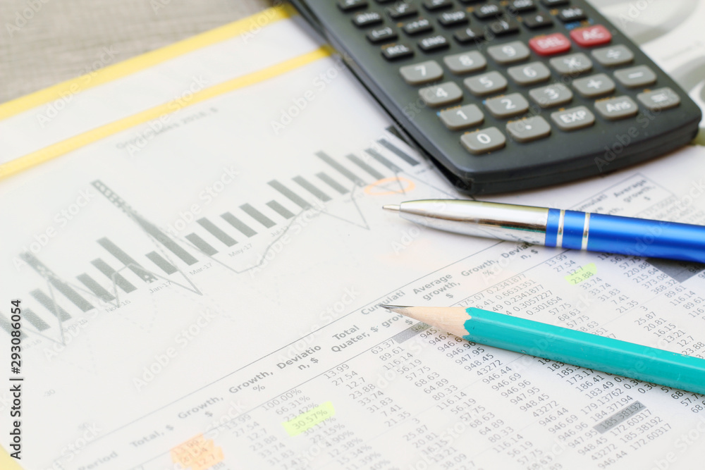 Business concept with a report and a calculator Business concept with a report and a calculator