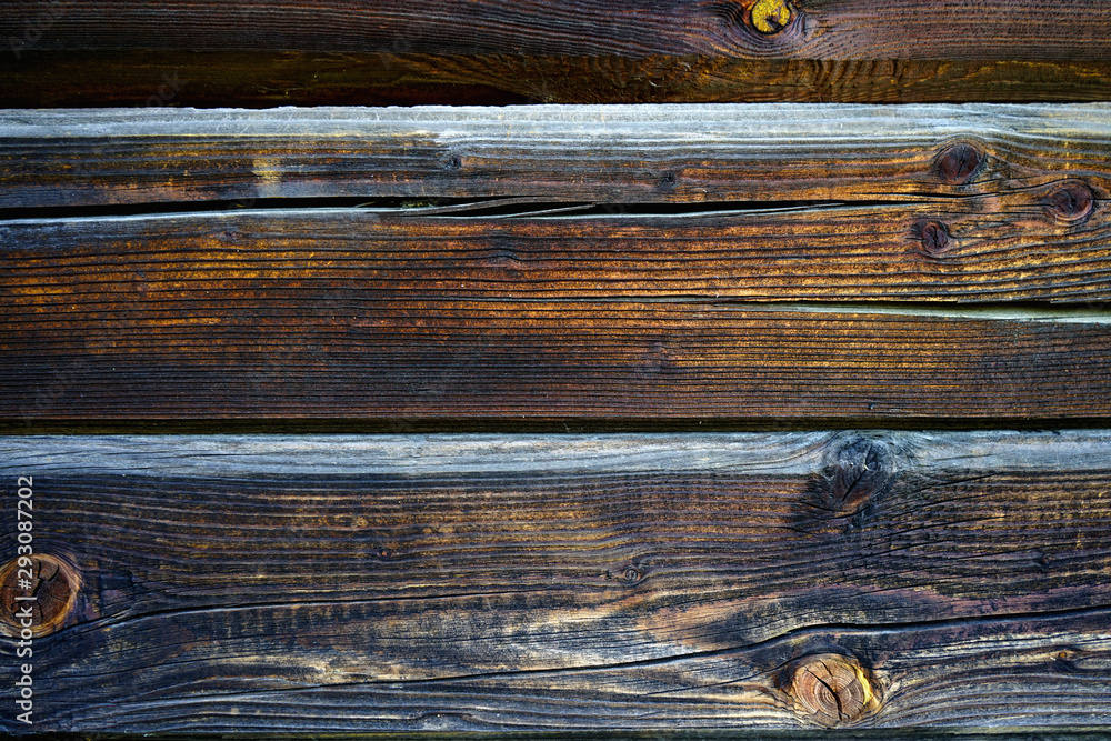 Texture background, old wooden boards. Semicircular logs, hut. Texture background, old wooden boards. Semicircular logs, hut.