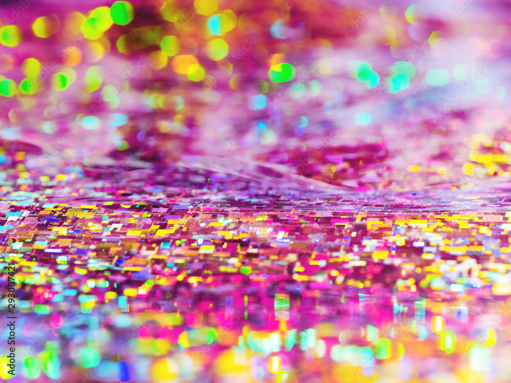 Bright magenta background. Shiny and sparkling holographic rainbow backdrop.