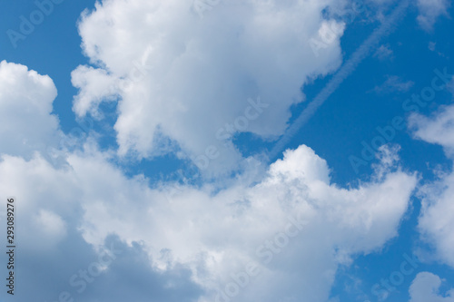 white clouds in the blue sky during