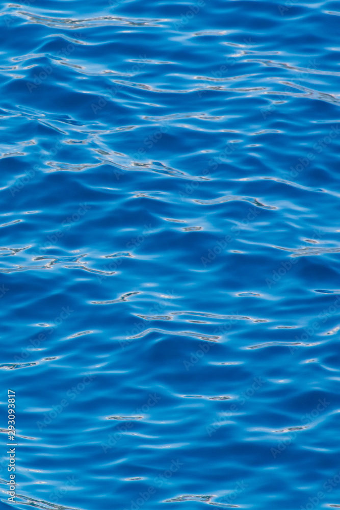 Blue expanse of water at sea as abstract background