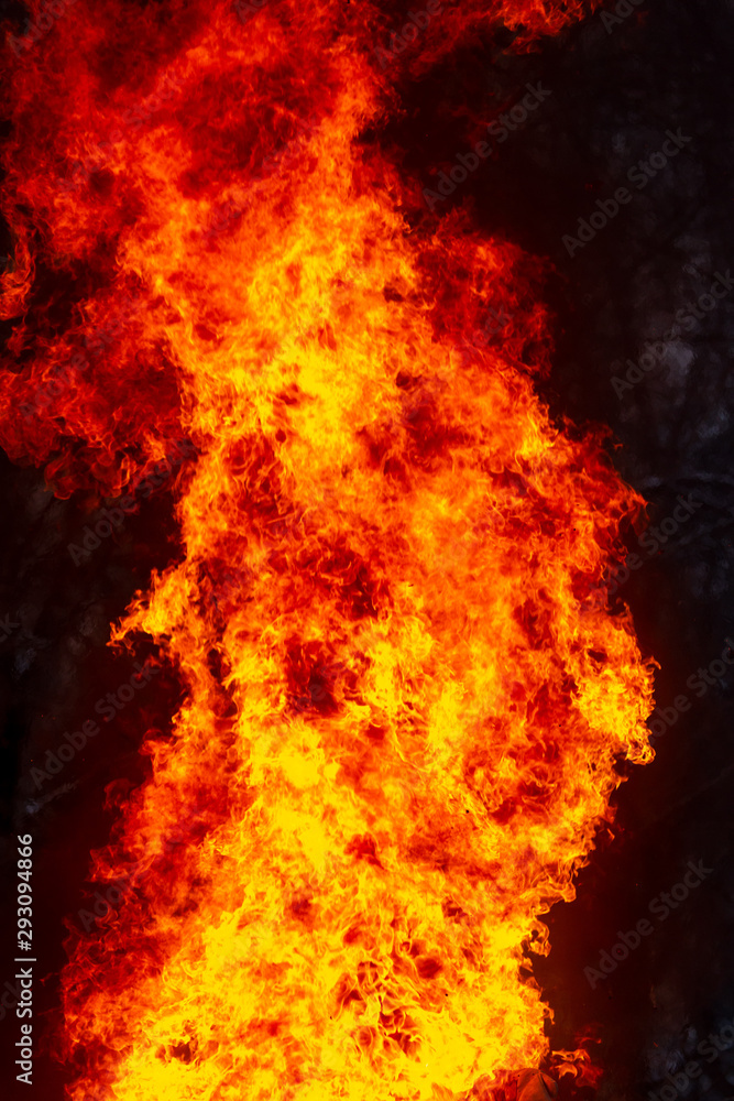 Flame of fire from a burning house as an abstract background Flame of fire from a burning house as an abstract background