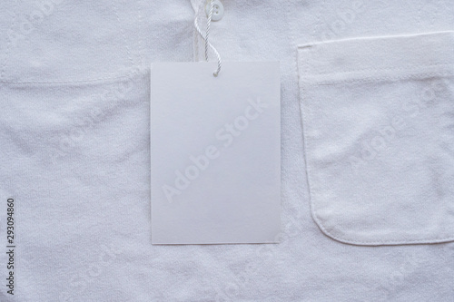 Blank white clothes tag label on new shirt