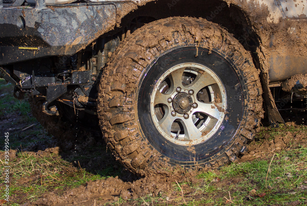 SUV wheel stalled in mud and water SUV wheel stalled in mud and water