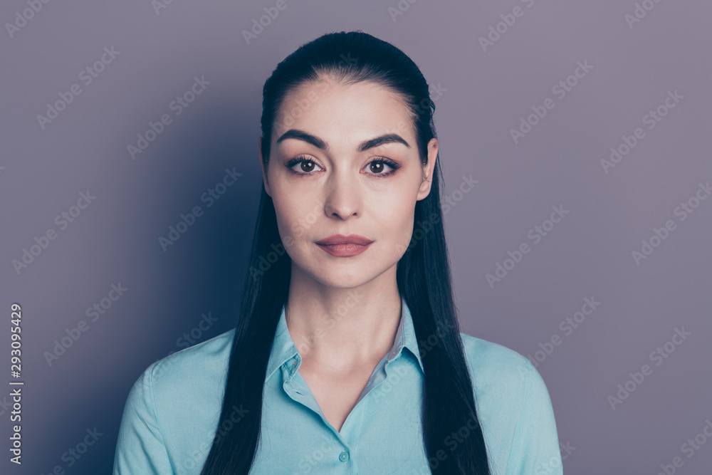 Close up photo of fascinating office manager looking pensively into camera with her deep hazel eyes isolated over grey color background Close up photo of fascinating office manager looking pensively into camera with her deep hazel eyes isolated over grey color background