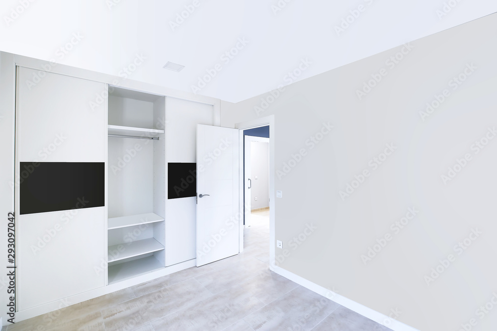 New beautiful empty room with built-in wardrobes. Interior modern room.