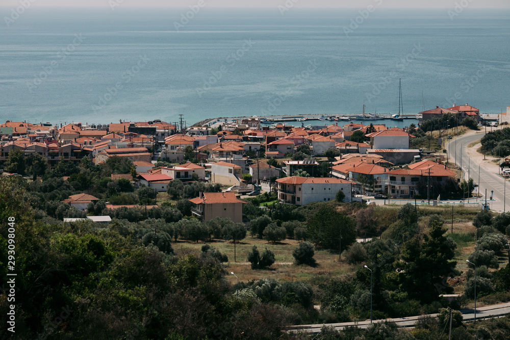 panoramic view of a Mediterranean village by the sea in summer. Greece