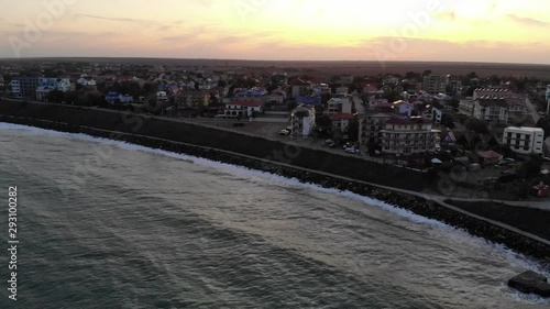 Aerial view slowly approaching the newly developed apartments on the seafront at Costinesti, at sunset photo