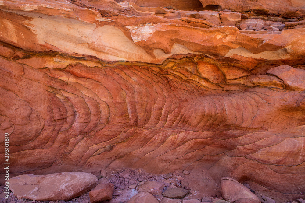Background based on red sandstone texture. Photos of the walls of the canyon in the Sinai desert Background based on red sandstone texture. Photos of the walls of the canyon in the Sinai desert