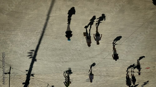 crowd filmed in reflexion on a metal mirror ceiling in the city of Marseille France