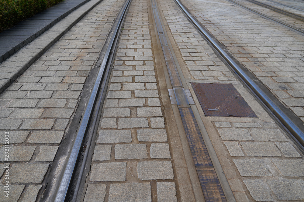 railway track of the tram in the city on the paved road