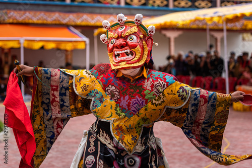Monk performing a ritual dance in Takthok monastery, Ladakh © luisapuccini