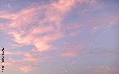 Fototapeta Naklejka Na Ścianę i Meble -  Beautiful pink clouds during sunset, blue sky with clouds background.
