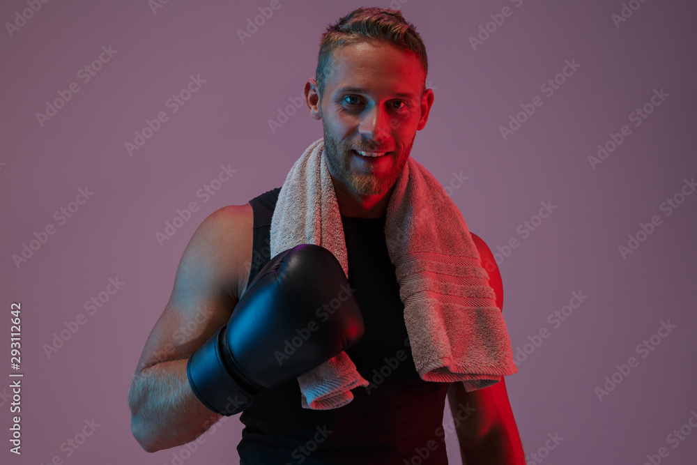 Sports man boxer in gloves with towel.