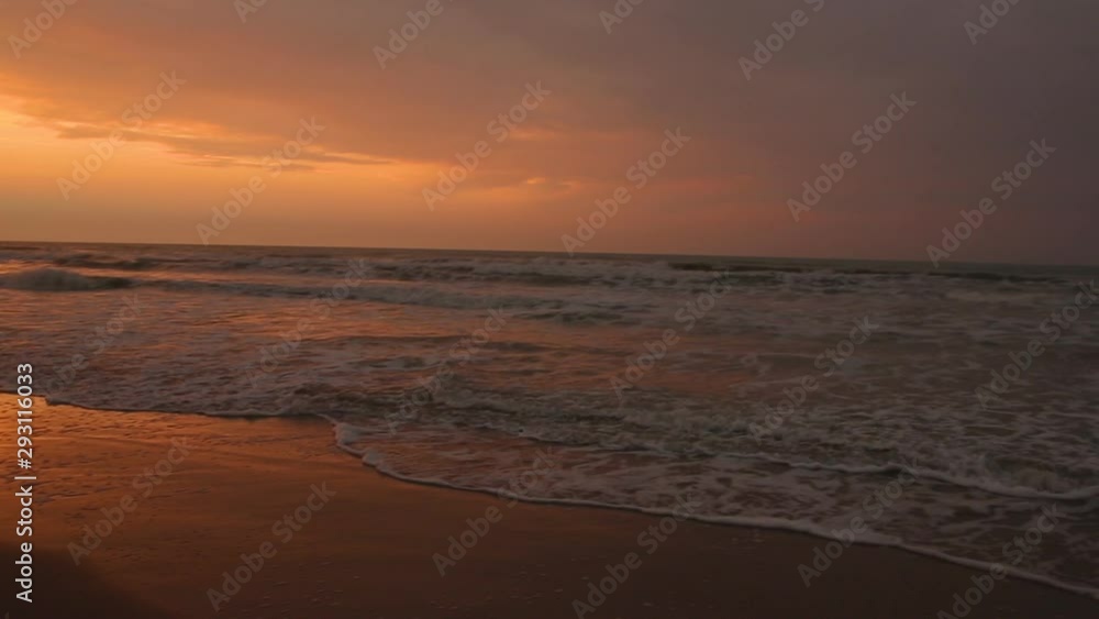 Pan shot of sea coast at dusk, golden sunset contrasting evening shadows Pan shot of sea coast at dusk, golden sunset contrasting evening shadows
