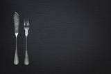 Cutlery for fish on a slate background