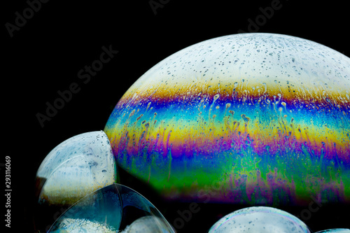 Distant fantasy planet - colorful  soap-bubble abstract on black background