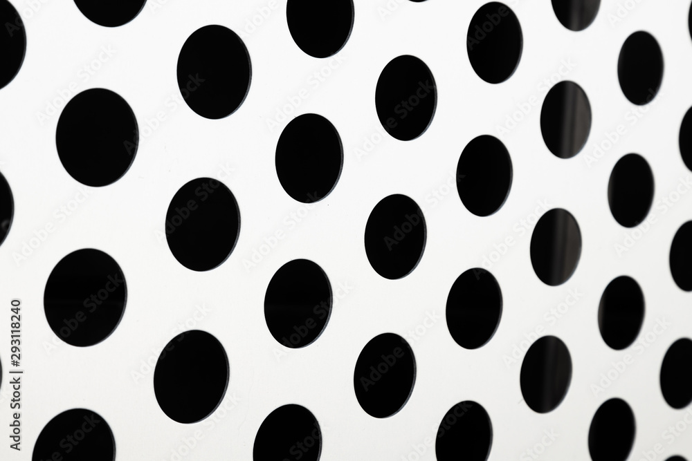 Rapid black big dot pattern on white background, round holes texture on perforated metal panel surface