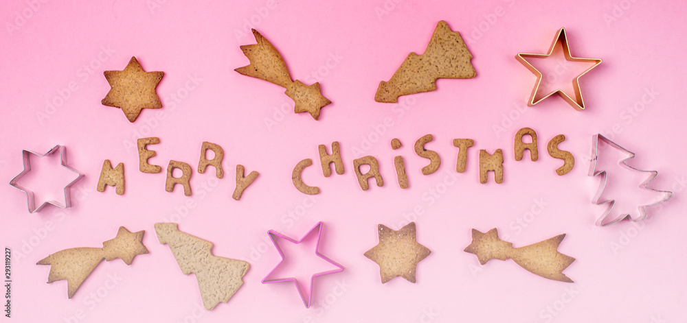 Christmas Concept Background Gingerbread Cookies Cookies Mold on Pink Background Merry Christmas Gingerbread in Shape of Letters Top View Flat lay Long