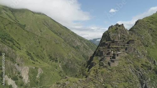 Aerial view of an ancient abandoned village high in the mountains of El Ahdar. El Ahdar is a mountain system in Oman. It is part of the Hajar mountain system. photo