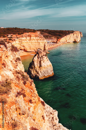 Beautiful coastline with ocean view and rock islands and beaches on a bright sunny summer vacation day. Lagos, Faro, Portimão, Algarve coast in Portugal, Atlantic Ocean