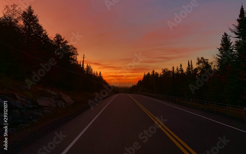 A foggy sunrise along highway 60 in Algonquin Park, Canada in early autumn