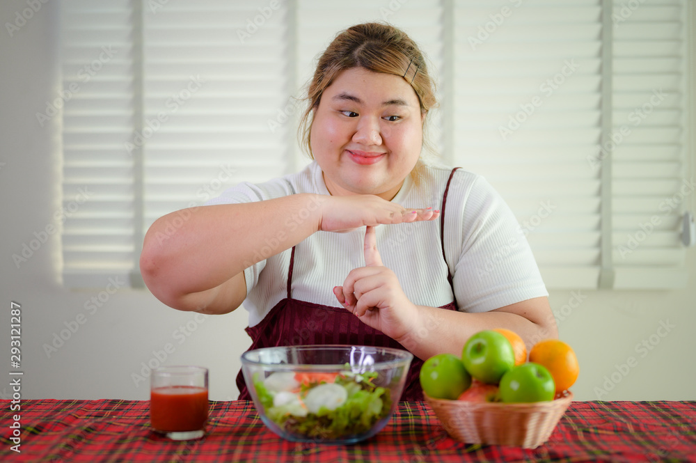 plump fatty woman anti and refused to eat salad vegetable and fruit on table, do not wants to eat salad food, against vegetable green salad, un-preferable fruit vegetable salad plump fatty woman anti and refused to eat salad vegetable and fruit on table, do not wants to eat salad food, against vegetable green salad, un-preferable fruit vegetable salad