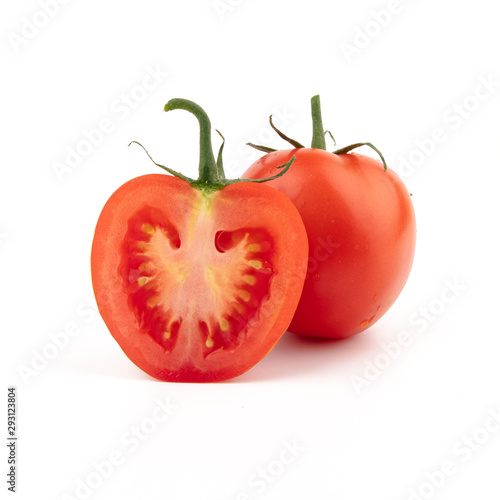 Red tomato in a cut and whole. Isolated on a white background. 