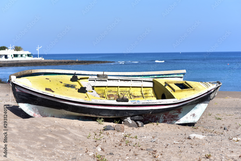 Yellow fishing boats on the beach at Playa Blanca in Lanzarote, Canary Islands, Spain Yellow fishing boats on the beach at Playa Blanca in Lanzarote, Canary Islands, Spain
