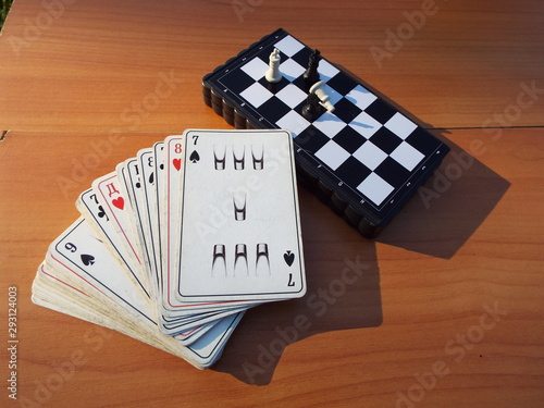 chess and playing cards on the table