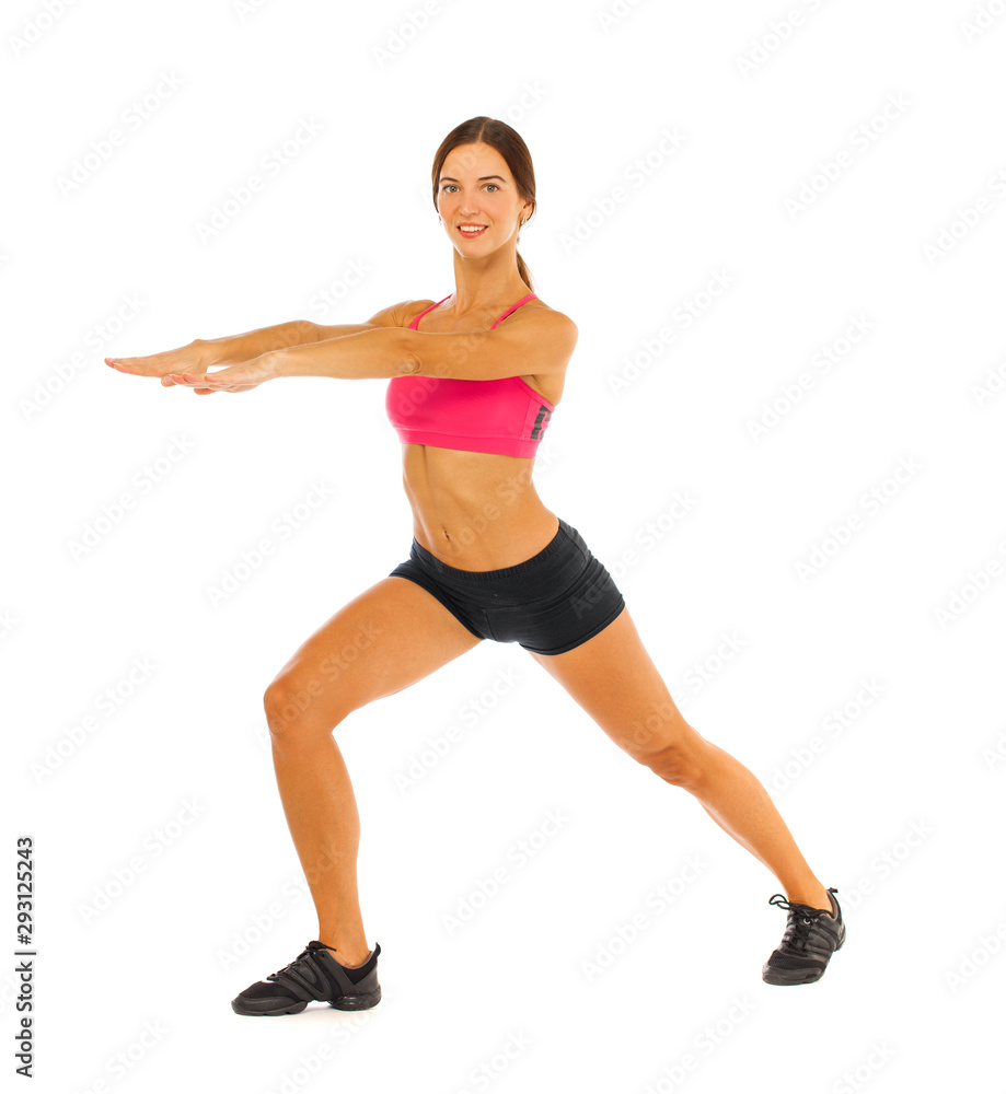 Young fitness brunette woman in red top and black shorts Young fitness brunette woman in red top and black shorts