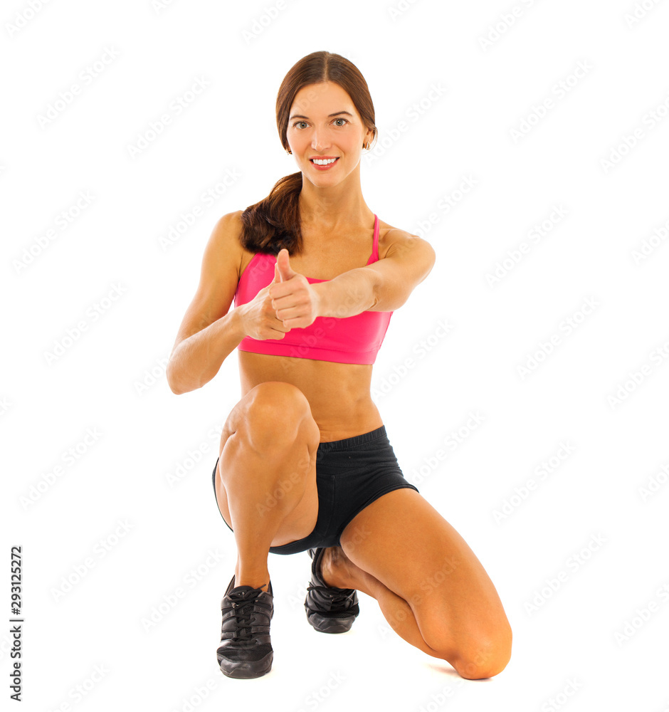 Young fitness brunette woman in red top and black shorts Young fitness brunette woman in red top and black shorts